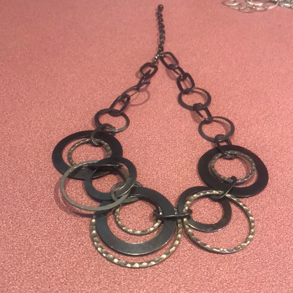Gunmetal and silver toned circle link necklace has a lot movement